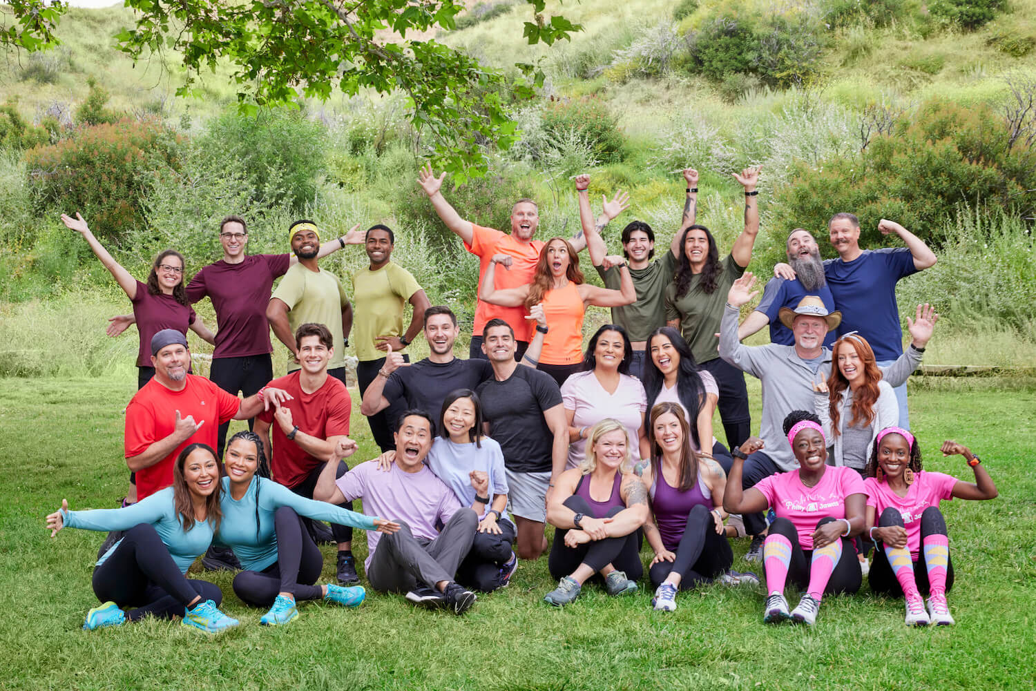 'The Amazing Race' Season 35 cast standing and sitting together with excitement